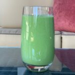 Mint green smoothie in glass.