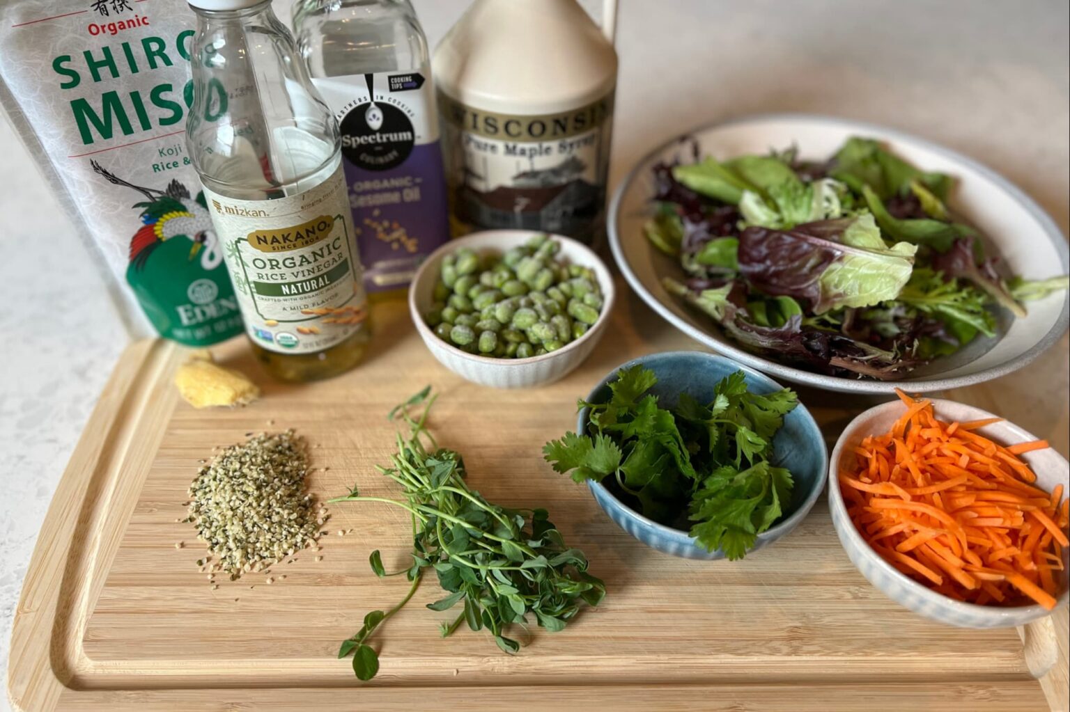 Greens Salad with Edamame Carrots Cucumber and Miso Ginger Dressing Real Food Well