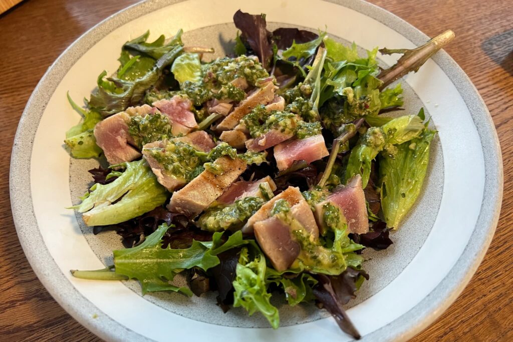 Seared Tuna and Mixed Greens Salad with Chimichurri Sauce.