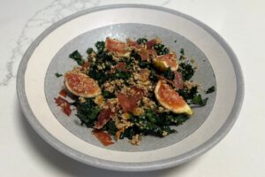 Kale and Fig salad with crispy prosciutto in bowl | Real Food Well