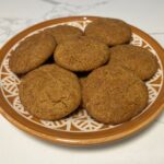 gingerdoodle cookies on orange plate.